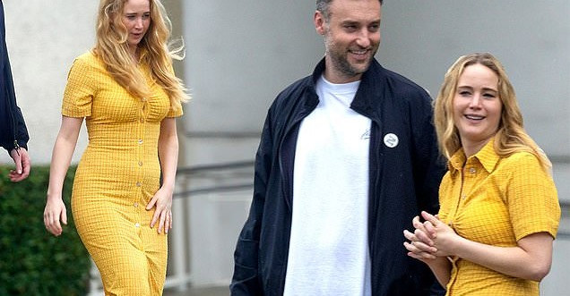 Jennifer Lawrence looks radiant in a clingy summer dress... as she and husband Cooke Maroney enjoy romantic day out in New Orleans