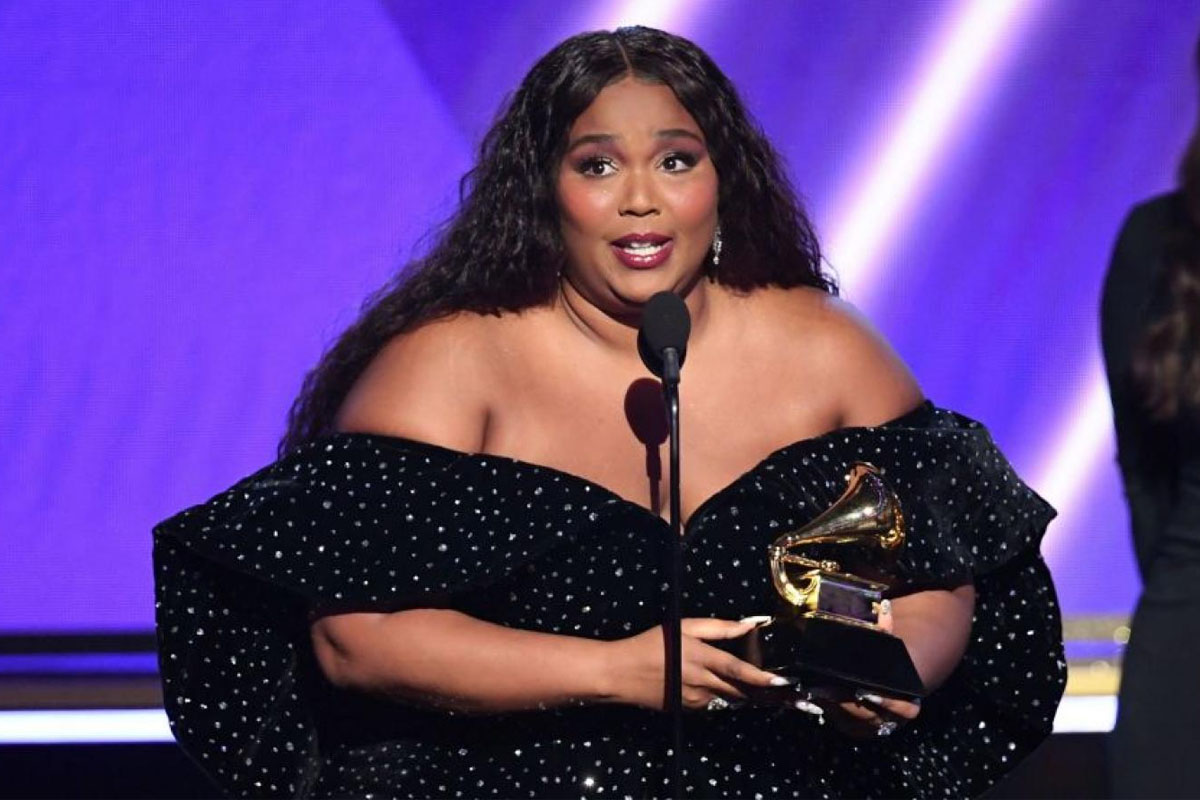Lizzo says she "got addicted" to seeing herself with makeup