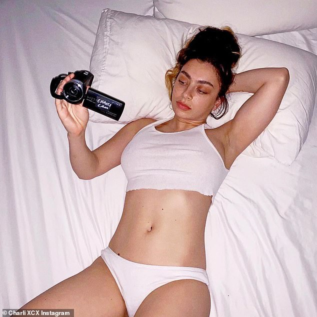 charli-xcx-goes-braless-in-a-cropped-white-vest-and-matching-underwear-1