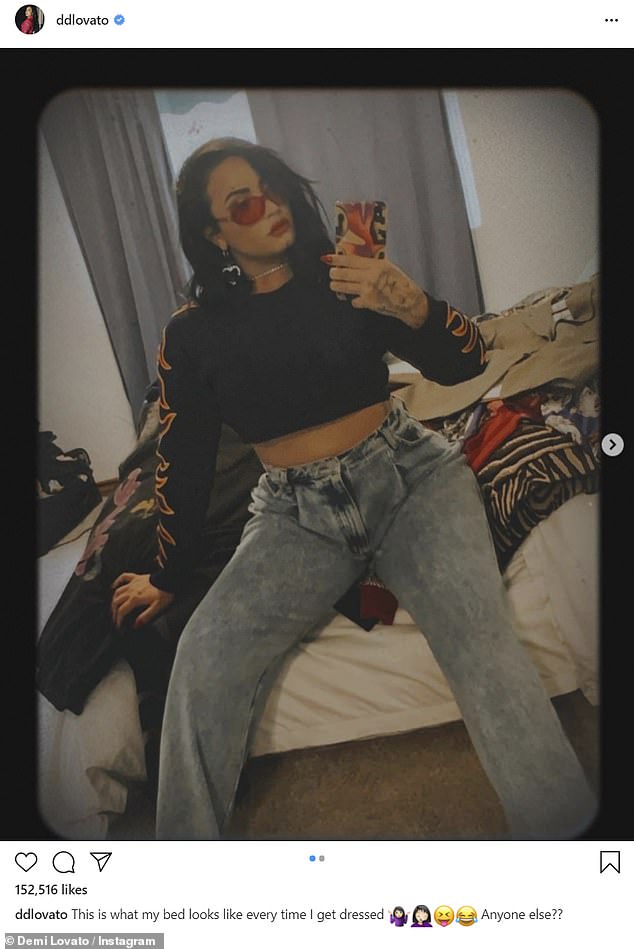 demi-lovato-shares-a-look-inside-her-clothes-strewn-bedroom-for-chic-mirror-selfies-2