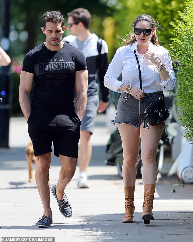 kelly-brook-puts-on-a-leggy-display-in-distressed-shorts-and-a-white-shirt-3