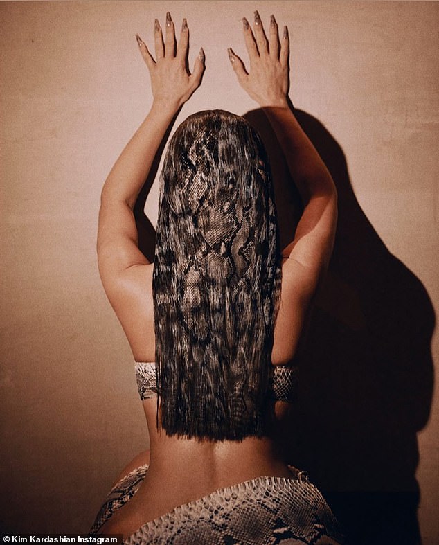 kim-kardashian-debuts-bold-fishnet-hair-in-sultry-snapshots-2