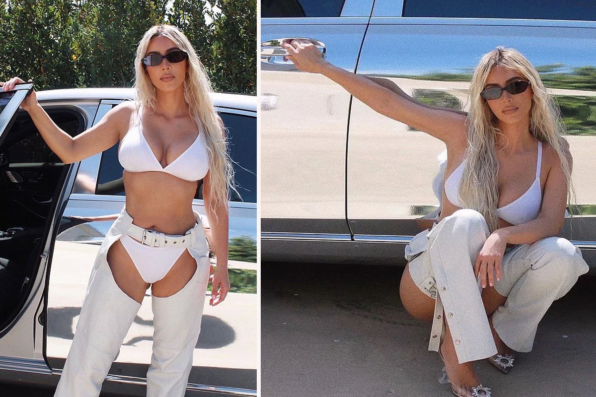 Kim Kardashian strips down to her underwear and a pair of white leather cow...