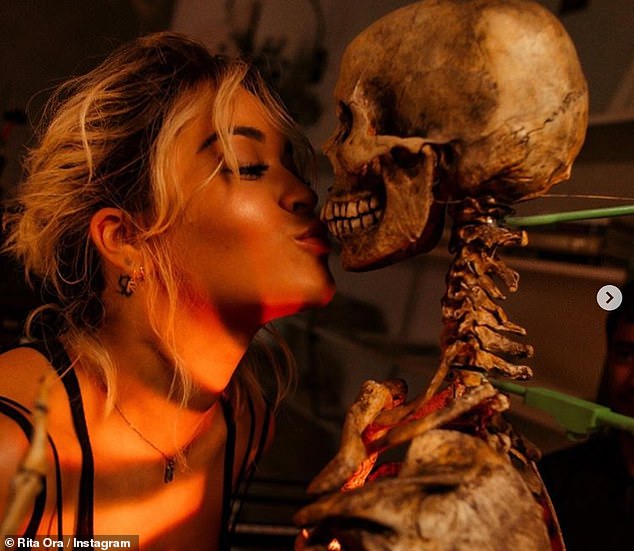 rita-ora-hugs-skeleton-in-a-playful-click-as-she-takes-look-at-immersive-video-experience-2