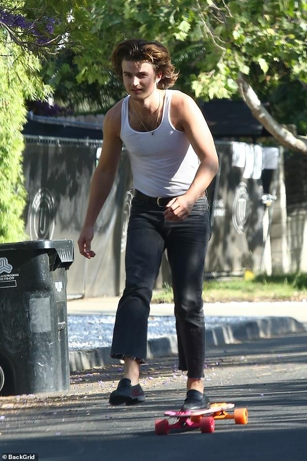 stranger-things-star-joe-keery-exhibits-his-unique-style-as-he-skateboards-in-a-vest-1