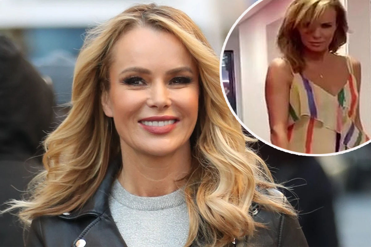 Amanda Holden puts on a giddy display as she twirls around in rainbow dress