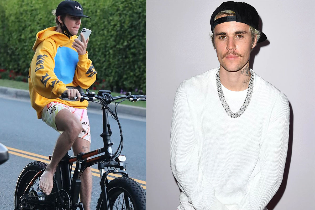 Justin Bieber chats away on his cellphone as he enjoys a barefoot bike ride in Los Angeles