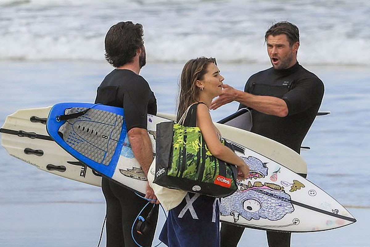 Liam Hemsworth hits the beach with his model girlfriend Gabriella Brooks and his brother Chris Hemsworth