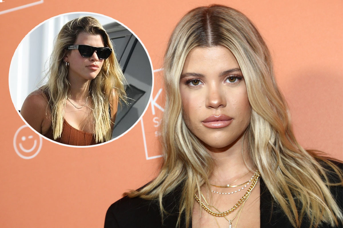 Sofia Richie flashes her taut abs in a one shoulder crop top