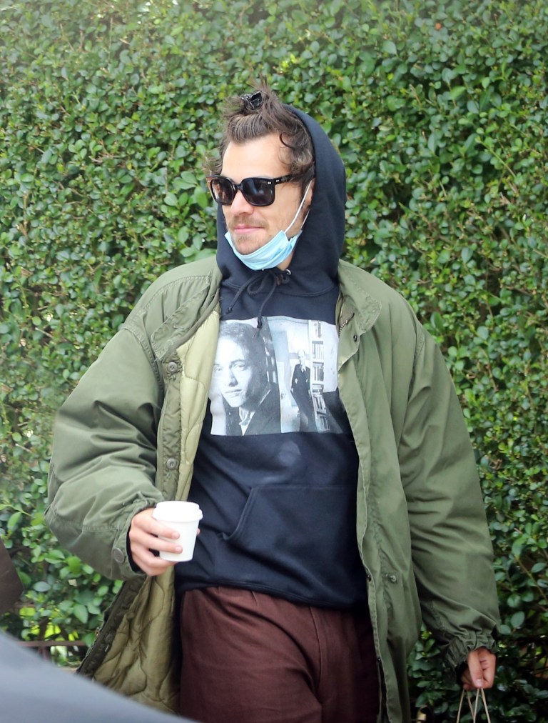 Harry-Styles-rocks-man-bun-while-going-shopping-with-friend-in-London-2