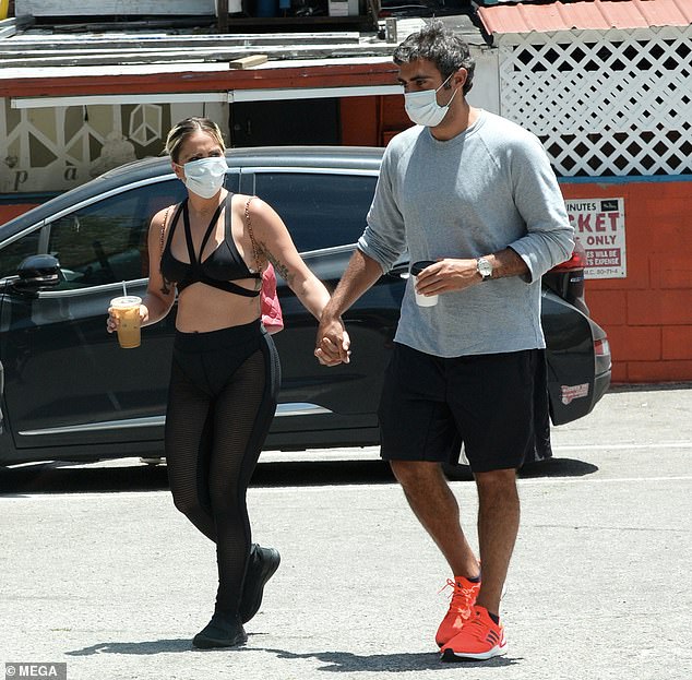 lady-gaga-masks-up-and-holds-hands-with-boyfriend-michael-polanksy-as-she-wears-strappy-bra-top-1