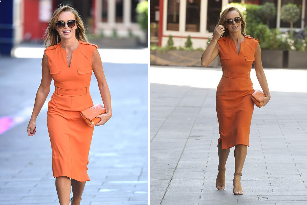 Amanda Holden displays her toned frame in orange bodycon dress paired