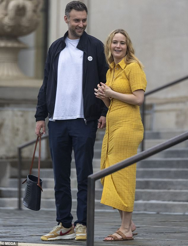Summer days: Jennifer Lawrence looks radiant in clingy summer dress... as she and husband Cooke Maroney enjoy romantic day out in New Orleans