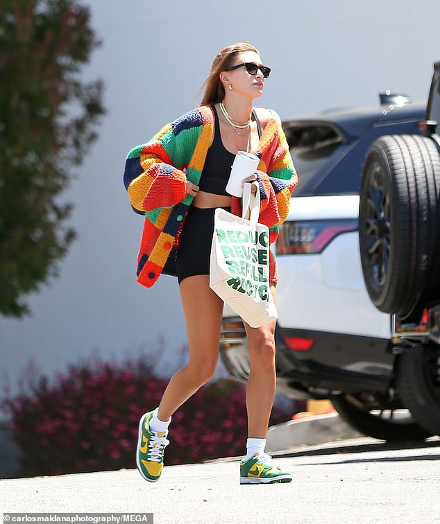 Making a statement! Bieber completed her vibrant look with an eco-conscious tote bag