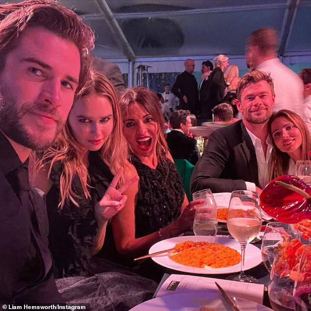 Star studded group: The actors (right) were joined at the event with Chris' younger brother Liam and his girlfriend Gabriella Brooks (left), and their friend Lucciana Barroso - the wife of actor Matt Damon (centre)