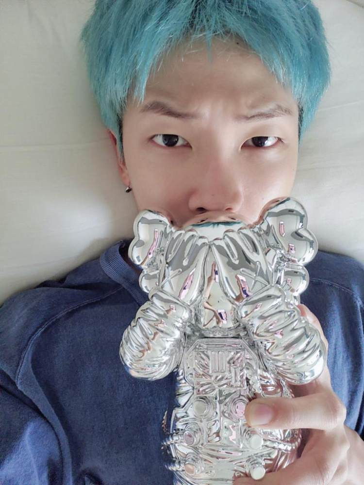 RM with one of his art figurines. Photo: @BTS_twt/Twitter