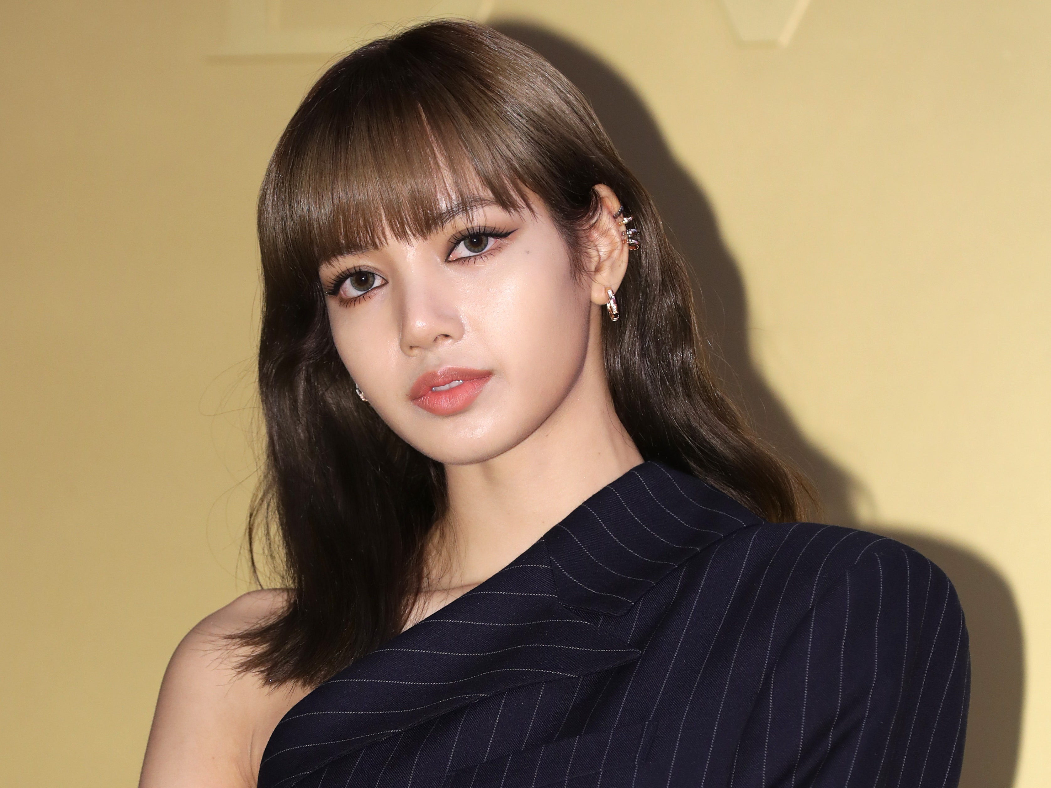 K-Pop Star Lisa of Blackpink Teased Solo Debut With Ultra-Long Braided  Pigtails | Photo | Allure